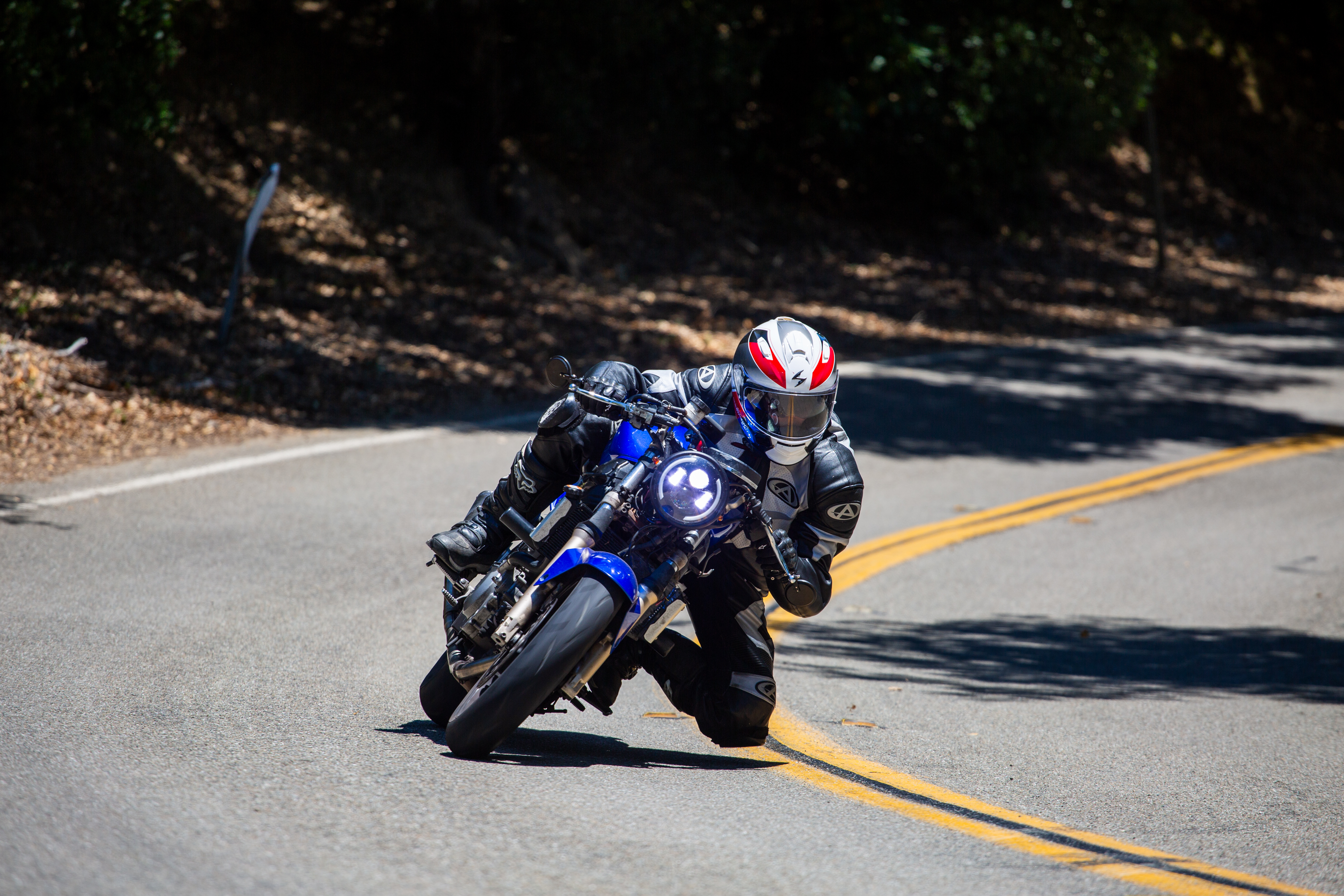 A man on a motorscycle.